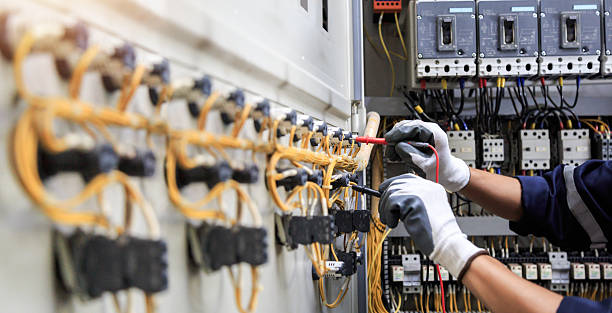 Professional Electrician technician working in Houston, AK